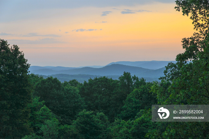 A beautiful sunset over the layers of mountains in Buffalo City, Arkansas