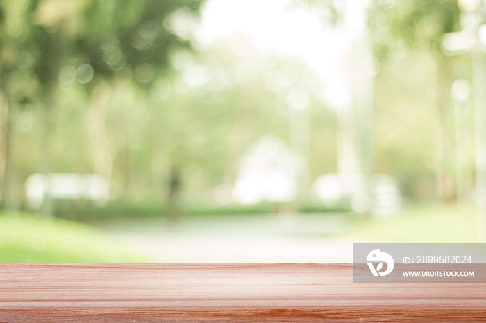 empty wooden on blurred nature backdrop. Wood table top. can used for display or montage your products