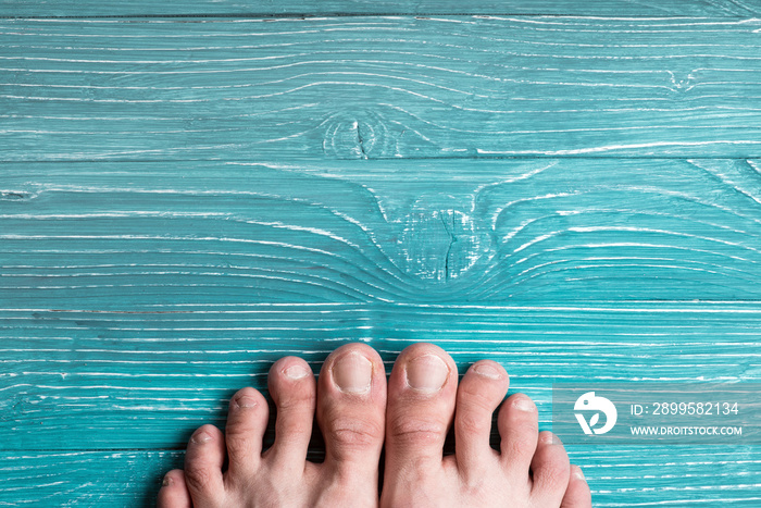 Toes on a background of blue board