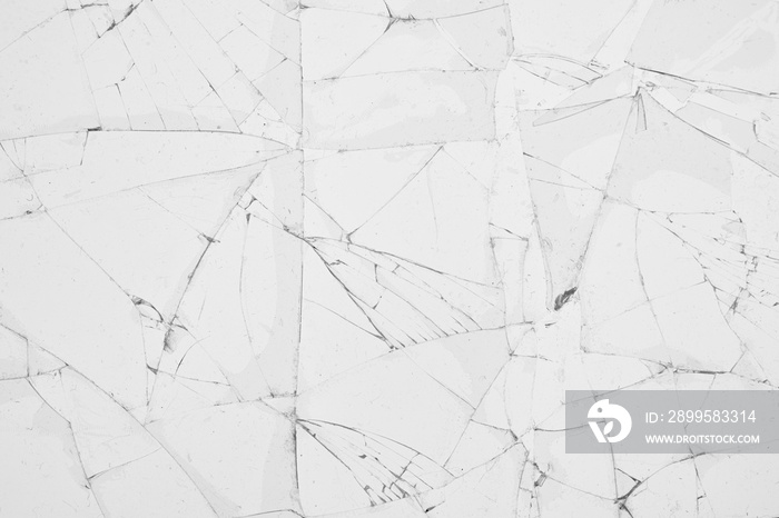 White cracked glass texture background. Texture broken glass window with cracks. Broken screen.