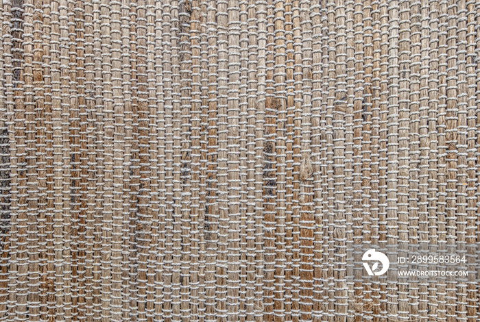 abstract of background woven rug texture in warm tones close up