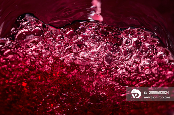 Abstract splashing of red wine.