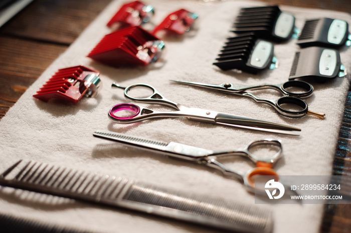 hairdressing tools on a towel - scissors, combs, clipper