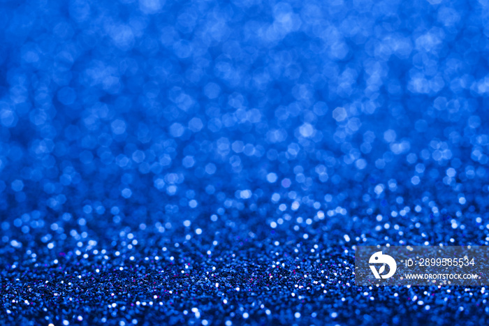 Shiny blue abstract christmas background. Blue glitter.