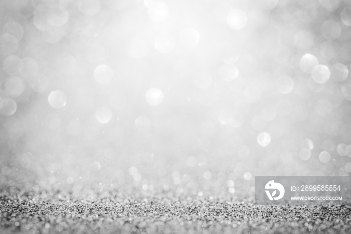 Silver glitter shiny abstract bokeh background Christmas.