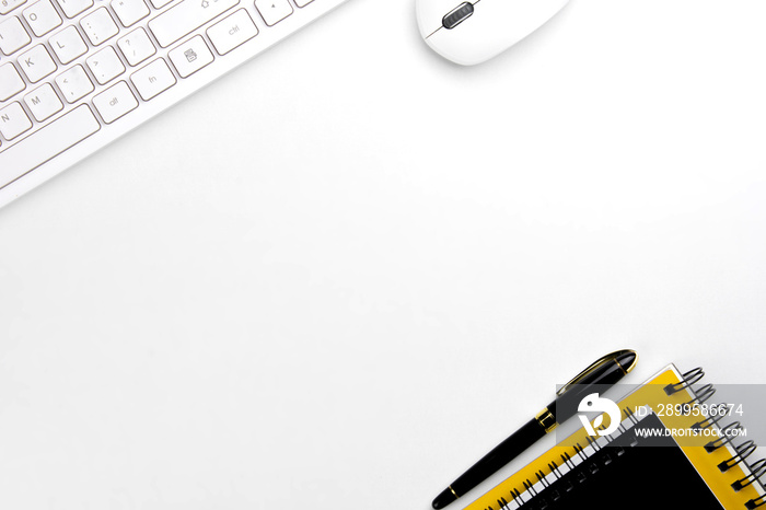 top view of modern white office desk with computer keyboard, blank notebook page and other equipment on white background. Workspace concept, workspace management style, business design space with copy