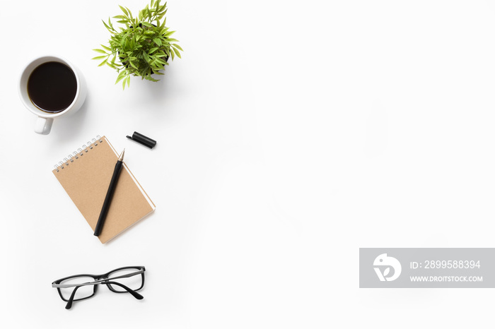 White office desk table with supplies. Top view with copy space, flat lay.