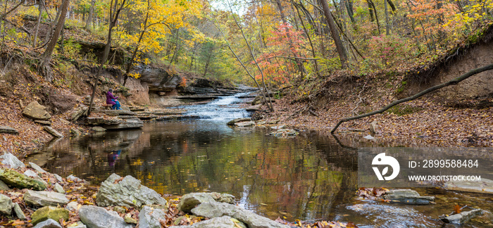 Tourists sitting on bench at Tanyard Creek Nature Trail Bella Vista, Northwest Arkansas