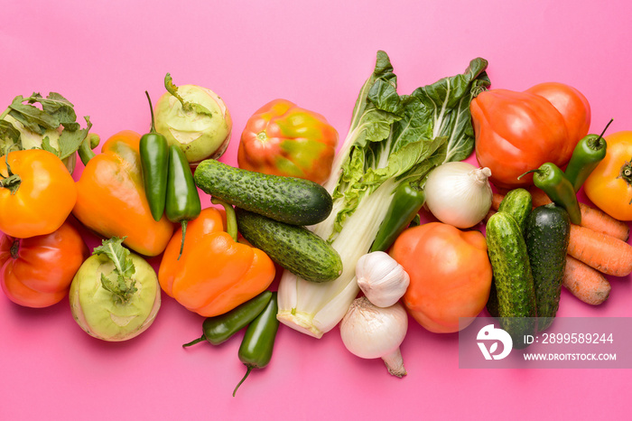 Assortment of fresh vegetables on color background