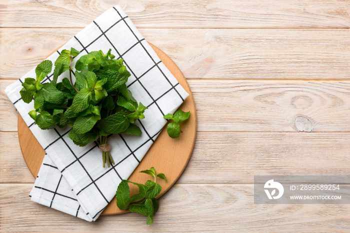 Fresh mint on Cutting board table, top view. Flat lay Space for text