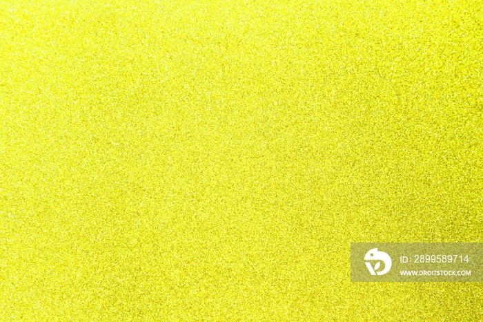 Yellow glitter shiny texture background for christmas, Celebration concept.