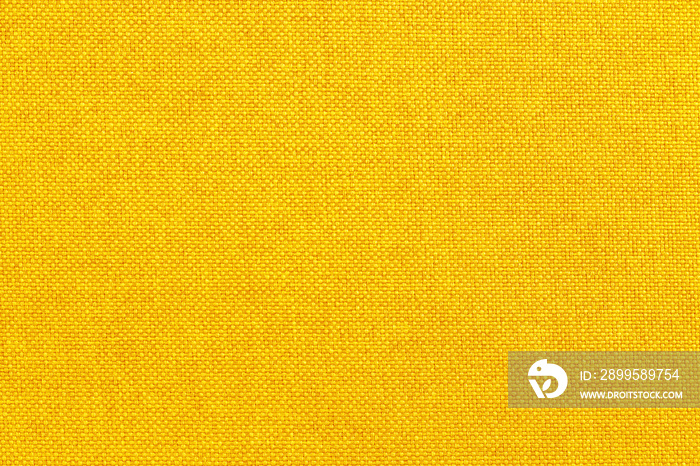 Golden yellow linen fabric cloth texture for background, natural textile pattern.