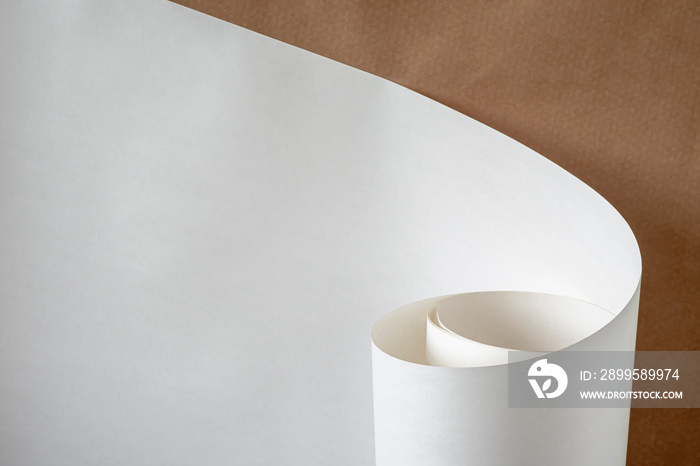 Roll of white paper on a brown background.