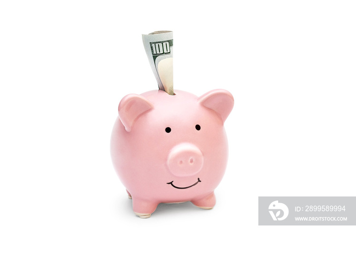 Folded money in piggy bank on white background.