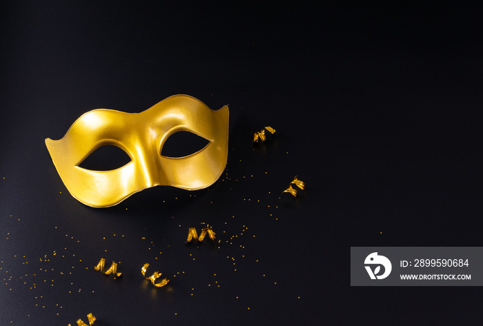 Golden carnival mask with copy space. Carnival, Mardigras, or Brazilian carnival concept.