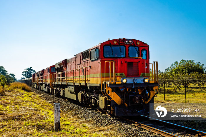 Red diesel electric locomotives pulling train