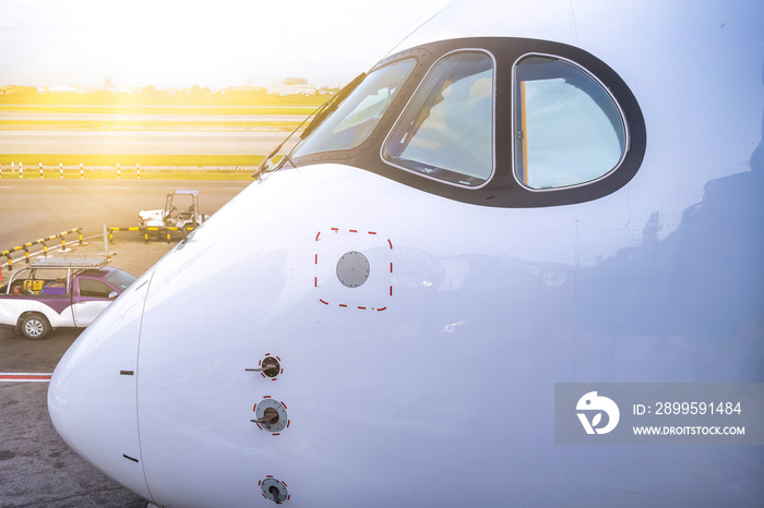 Cockpit view of modern airplane is parking at an airport before pilot and passenger come.