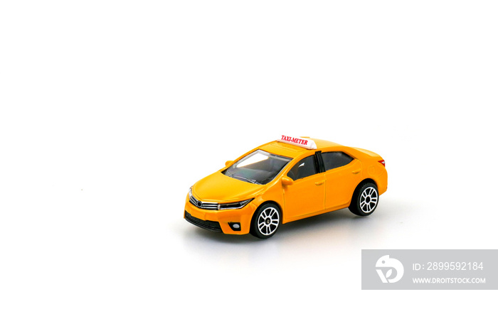 Yellow taxi - meter car model isolated on white with copy space for your text ,  toy - car model ,concept of urban service