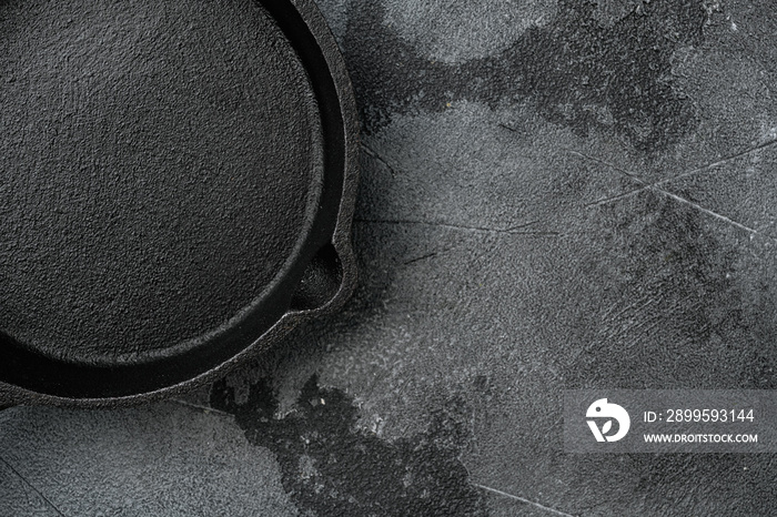 Used old empty frying pan with copy space for text or food with copy space for text or food, top view flat lay , on gray stone table background