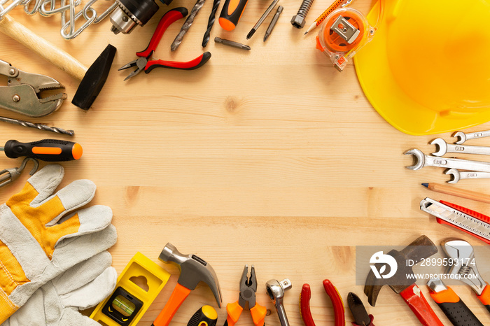 Labor day background concept.Variety of tools on wooden background with copy space for text.Top view of hand tools on a wooden table for labor day promotion