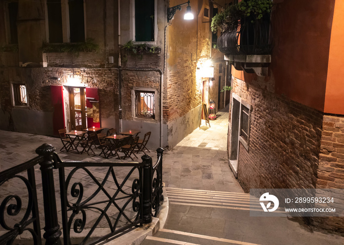 Romantic street in old town with restaurant