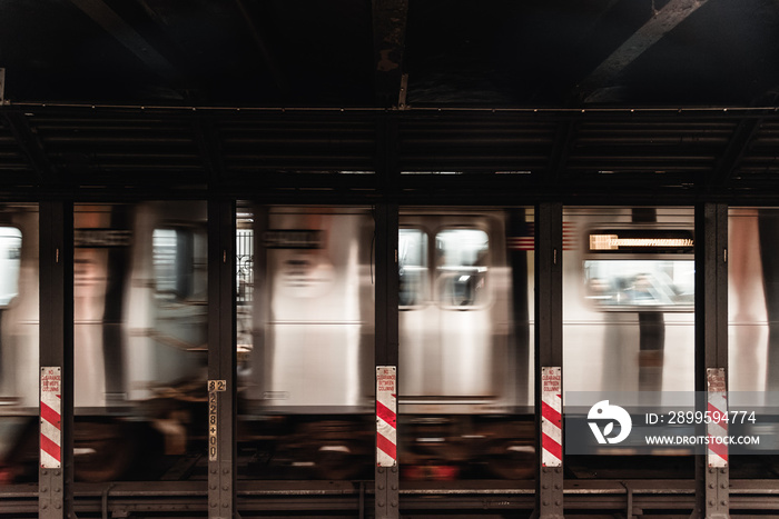 Subway station with moving train