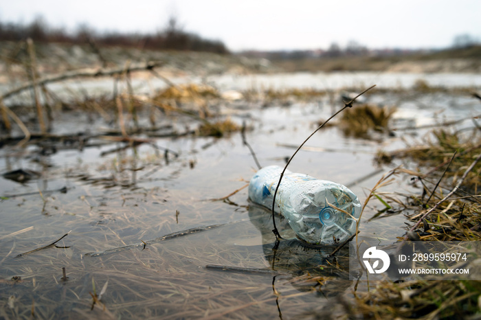 Plastic Bottles Floating in the river. River Pollution, PVC waste