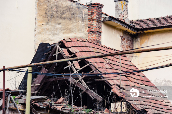 Damaged home roof after a natural disaster, earthquake, tsunami or even after war bombing