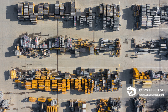 Aerial view of storage place. Construction materials in industrial city zone from above. Top view. Photo captured with drone.