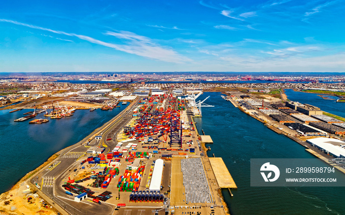 Aerial view of Dry Dock and Repair and Port Newark and Global international shipping containers, Bayonne, New Jersey. NJ, USA. Harbor cargo. Staten Island with St George Ferry terminal, New York City