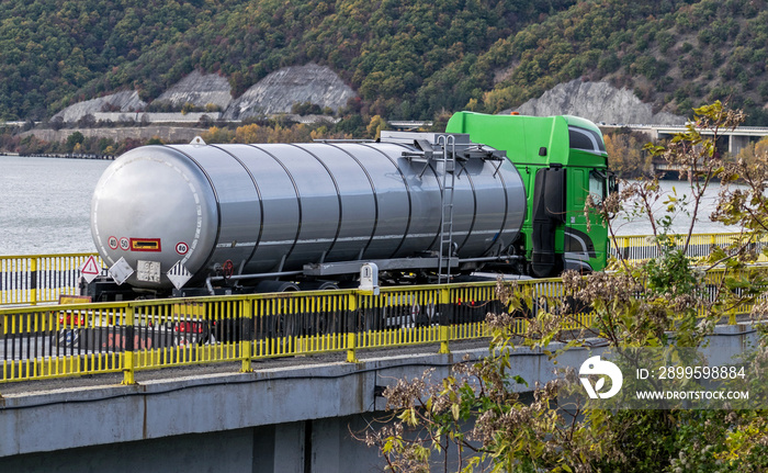 Fuel transport truck. Fuel truck crosses a bridge.