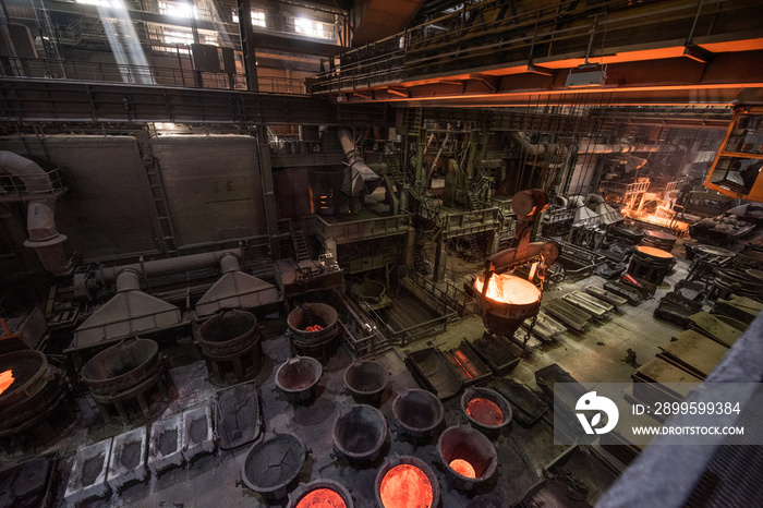 Tank with liquid metal at the steel mill. Interior of a steel mill.