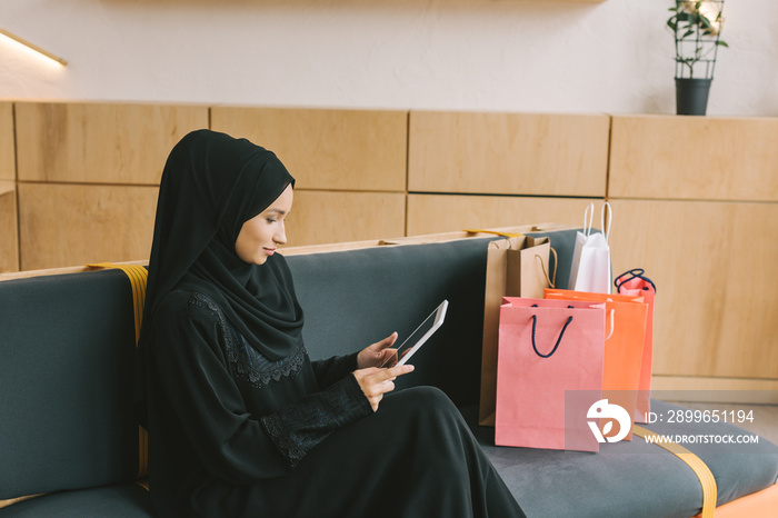 muslim woman using tablet