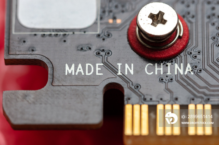 made in china inscription at hardware circuit board. china electronic industry.