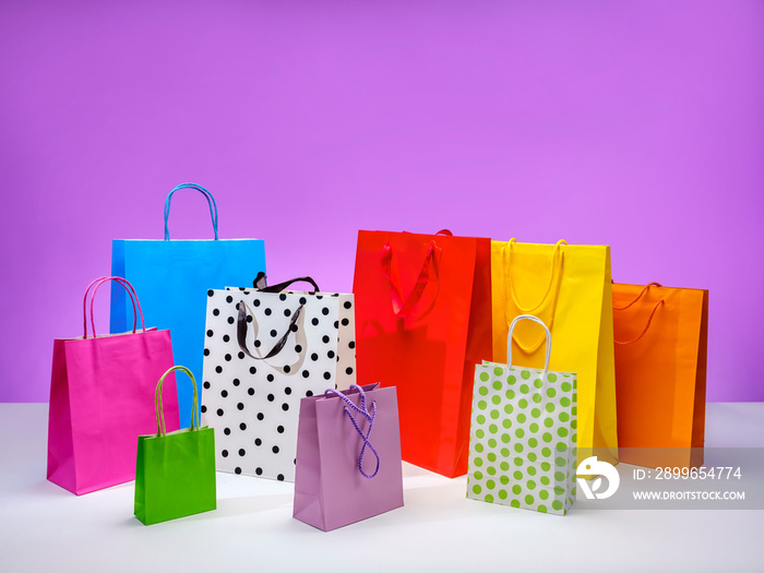 Colorful paper bags for shopping and gifts. Online sales concept. Goods on sale.