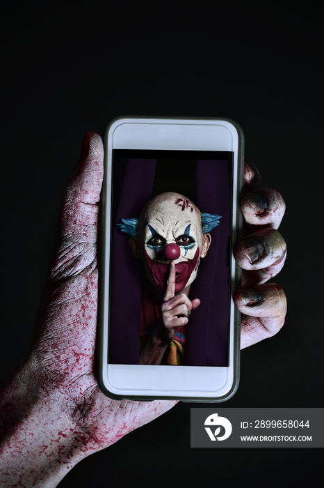 picture of an evil clown in a smartphone