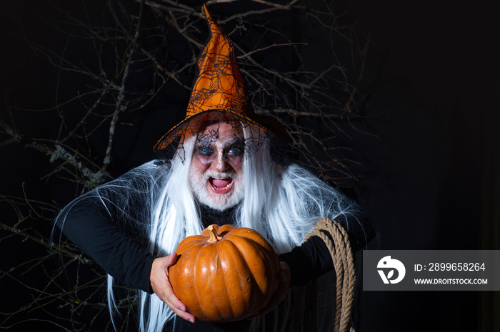 Halloween demon Concept. Halloween holiday celebration - Man demon on black background. Halloween co