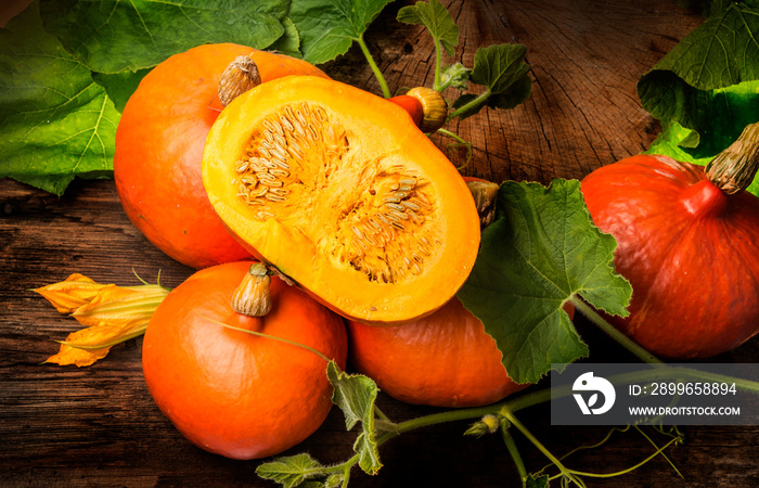 Pumpkins hokkaido on the wooden background close up