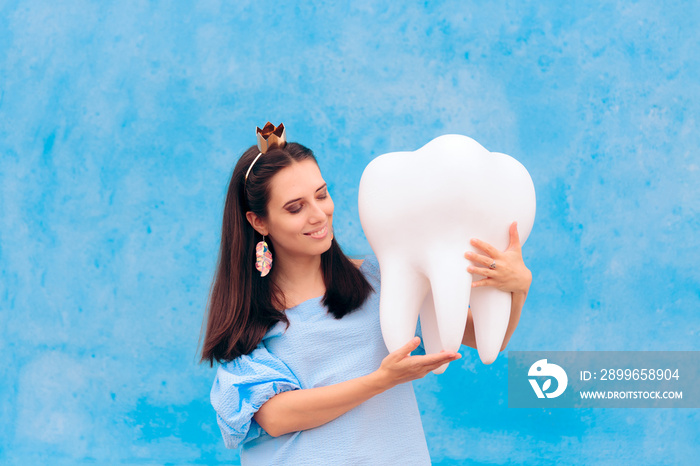 Woman in Tooth Fairy Costume Holding Big Molar