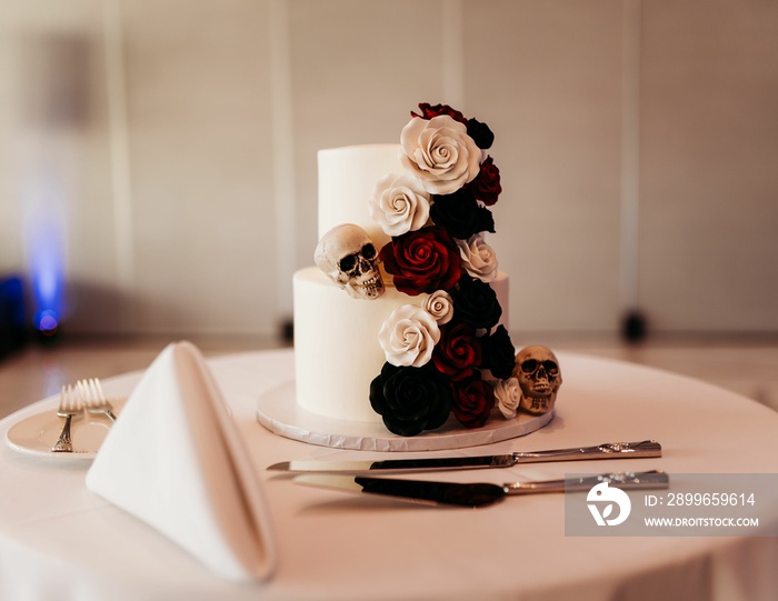 Beautiful closeup shot of a wedding cake with Halloween themed decoration