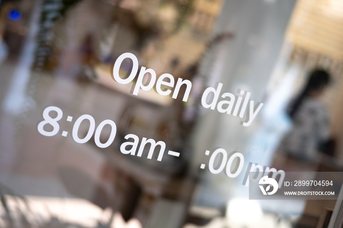 ‘Open’ on cafe or restaurant hang on door at entrance