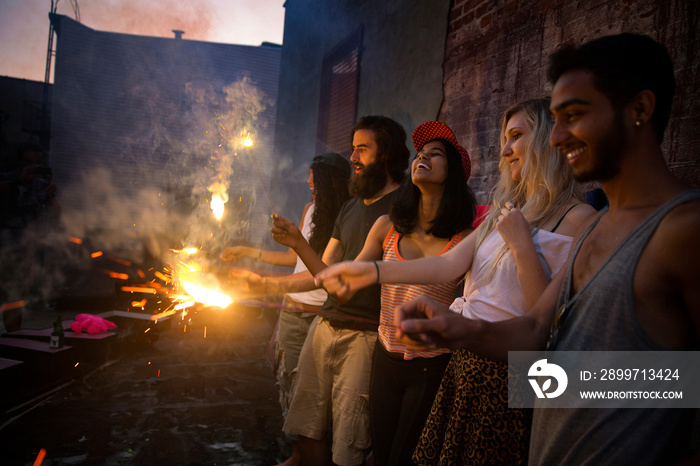 Friends holding sparklers