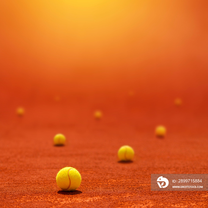 Tennis balls on clay court