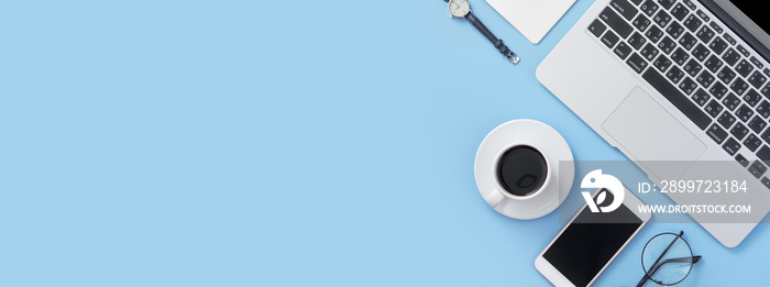 Freelancer blog writer woman drinking for relax on a clean light blue desk with coffee, work at home