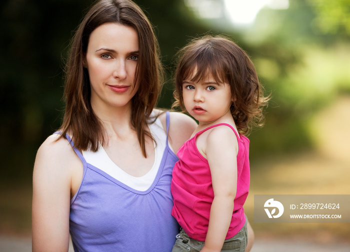 Portrait of mother holding daughter