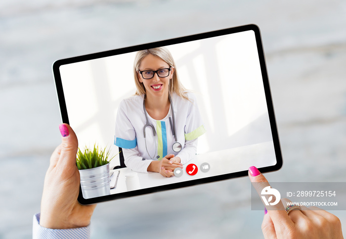 Person talking with doctor on video call on tablet computer