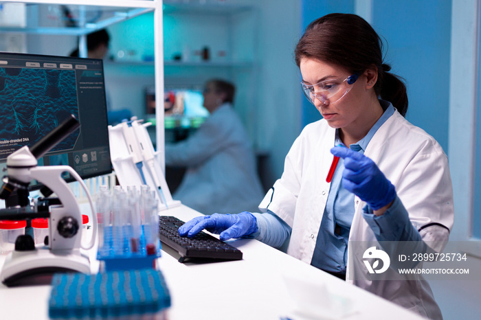 Professional doctor scientist holding vacutainer blood sample for medical experiment. Researcher in 