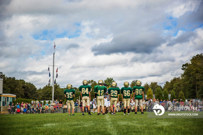 Boys (10-11) playing american football