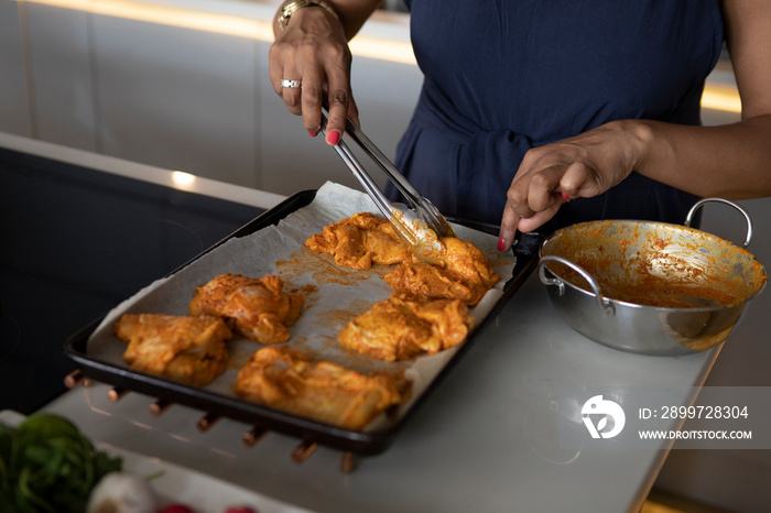 UK, London,�Close-up�of woman cooking in kitchen