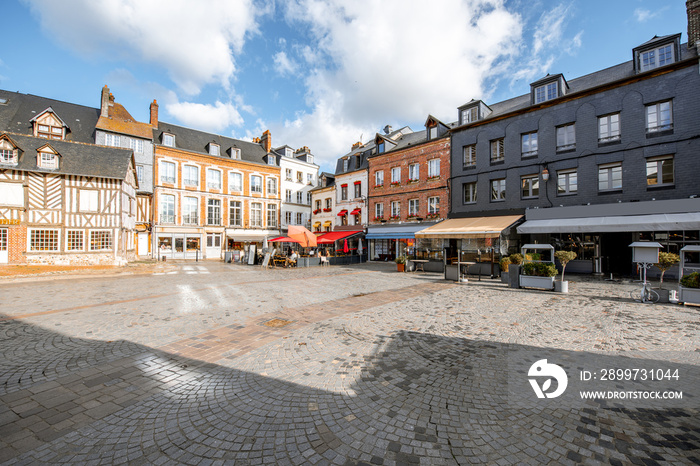 Beautiful facades of the old buildings in the central square in Honfleur, famous french town in Norm